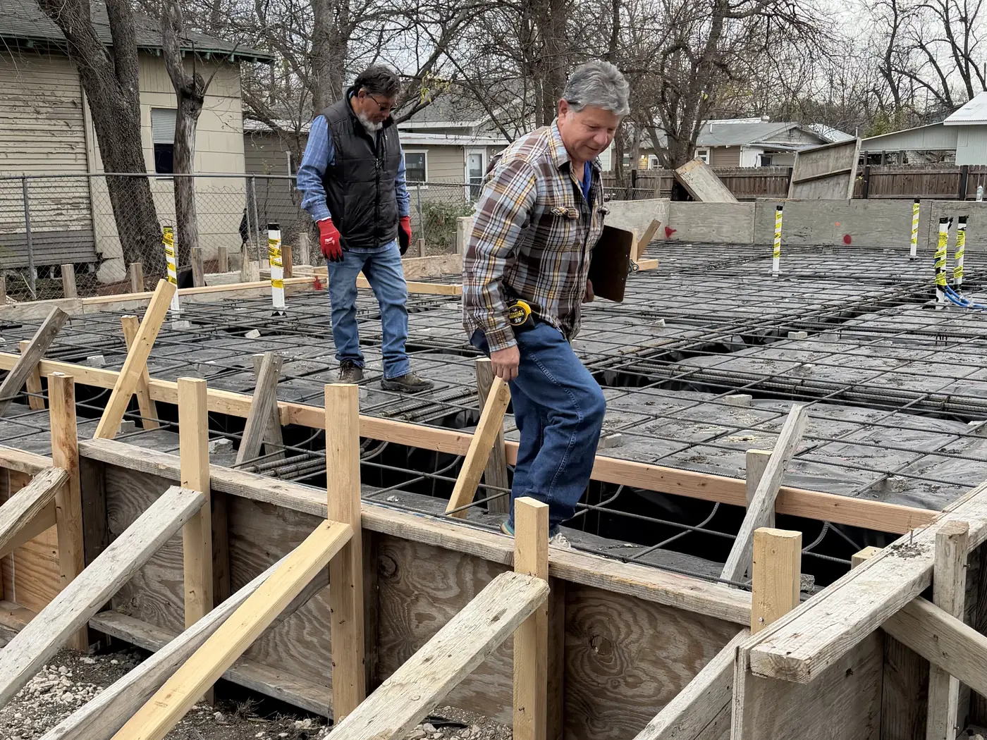 Crew setting foundation forms on a residential jobsite