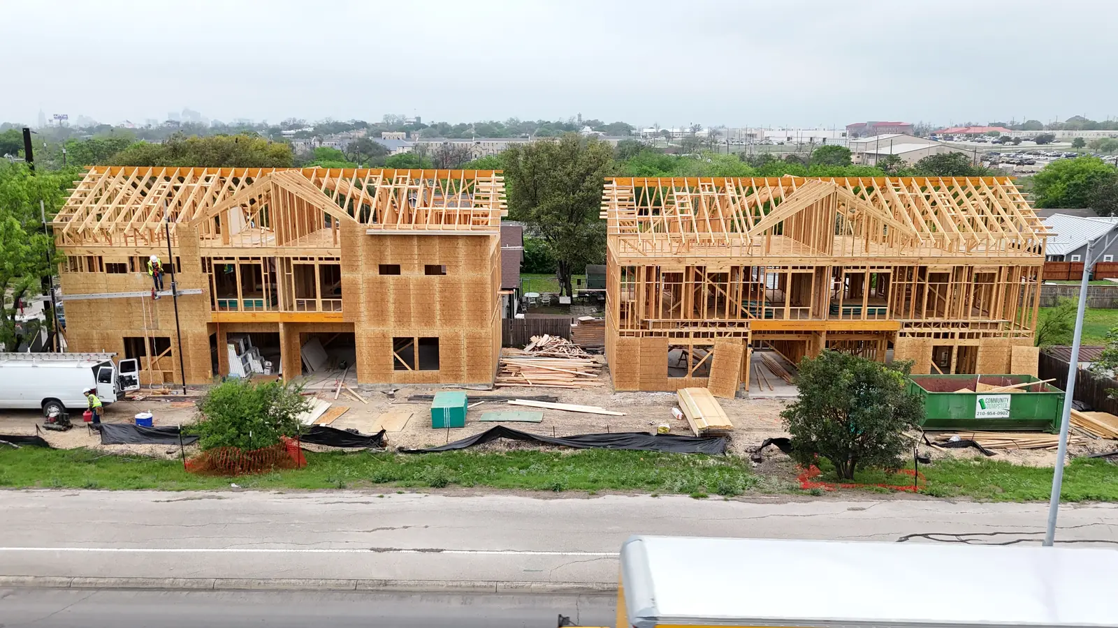Two-story homes framed in wood on a city street
